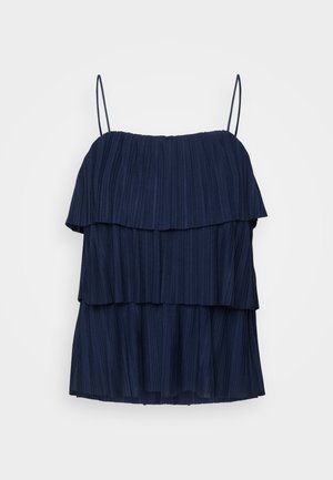 Navy blue sleeveless top with three layered ruffles and thin adjustable straps. Made from a textured fabric with vertical pleats.