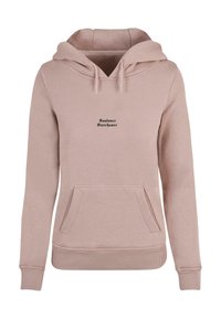 Rosa bomullshoodie med en ficka fram, dragsko på huvan och svart text "Sunlover Starchaser" på bröstet. Mjuk textur, avslappnad passform.