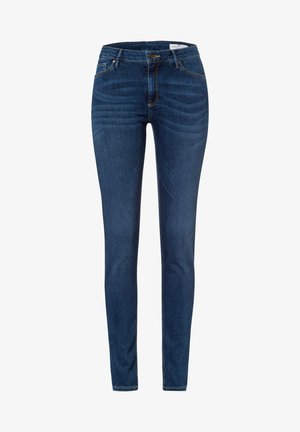 Chude dżinsy wykonane z ciemnoniebieskiego denimu. Posiadają pięć kieszeni, zapięcie na guzik z przodu oraz widoczne akcenty przeszyciowe.