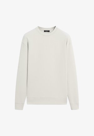 Světle béžová mikina s dlouhým rukávem a kulatým výstřihem, s žebrovanými manžetami a spodním lemem, položena rovně na bílém pozadí.