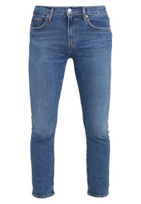 Slim-fit blå denimjeans med medelhögt midjeband, femficksdesign och kontrasterande sömmar. Tyget har en slät yta och en lätt blekning.