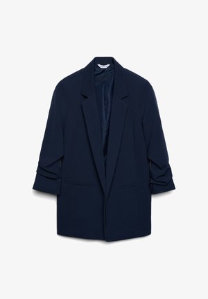 Blazer blu navy con design sartoriale, ampi risvolti, maniche arrotolate, due tasche frontali e una fodera interna liscia.