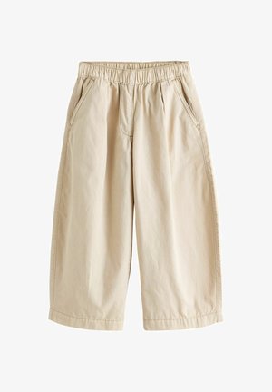 Világosbarna, széles szárú, rövidített nadrág rugalmas derékpánttal és oldalzsebekkel, könnyű anyagból készült.