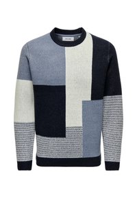 Heren crewneck trui met geometrische kleurblokken in grijstinten, zwart en crème, met gevarieerde breipatronen op de mouwen en het lichaam.