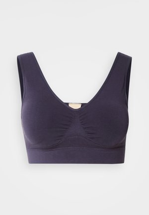 Reggiseno sportivo senza cuciture di colore viola scuro con ampie bretelle, scollo a V e pannello testurizzato sotto il seno per supporto e comfort.