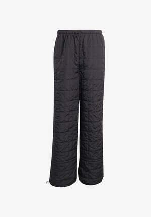 Pantalones acolchados negros con un diseño de acolchado. Presentan una cinturilla elástica con cordón y piernas anchas y rectas. Textura suave en todo su conjunto.