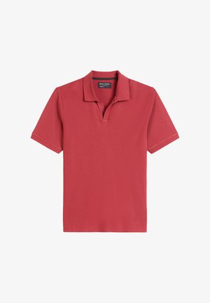 Rode polo shirt van katoen met een klassieke kraag, korte mouwen en een ontspannen pasvorm. Bevat een subtiele knoopsluiting en geen zichtbare patronen.