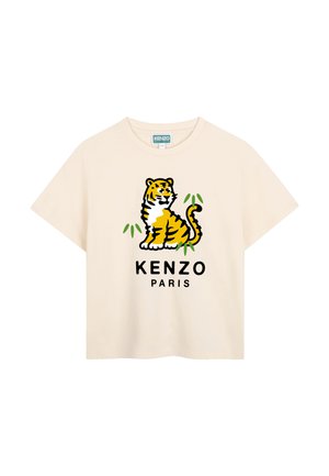 T-shirt beige à manches courtes avec un tigre en dessin animé et des feuilles vertes au-dessus du texte "KENZO PARIS" sur le devant.