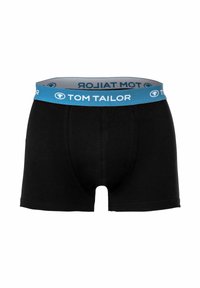 Boxer a tinta unita nera in cotone con cintura elastica blu che presenta il logo "TOM TAILOR" in bianco. Design semplice e comodo.