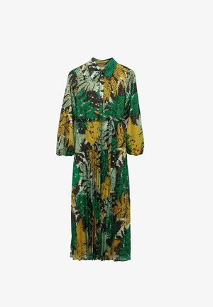 Vestito a maniche lunghe con colletto, caratterizzato da un motivo a foglie verdi, gialle e marroni. Bottoni sul davanti e cintura in vita, realizzato in tessuto leggero.