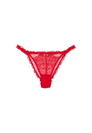 Tanga rojo de encaje con estampado de lunares, que presenta bordes rizados y un lazo decorativo en la parte frontal. Material suave y transparente.