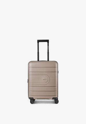 Kleiner beiger Hartschalenkoffer mit schwarzem Teleskopgriff und vier schwarzen Spinner-Rollen, Markenname Redolz vorne und am Griff sichtbar.