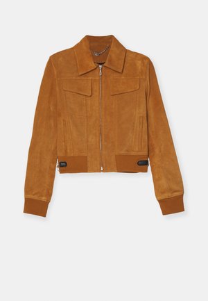Brown suede cropped jacket with a pointed collar, front zipper, two chest pockets, and ribbed cuffs. Features a black accent at the waist.
