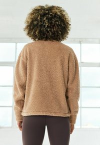 Next Forro polar - beige