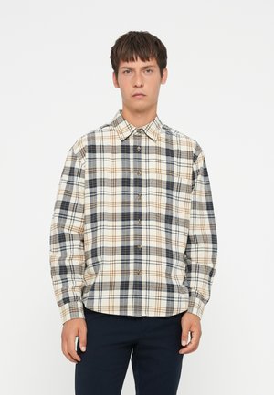 Men's button-up shirt in cream, featuring a plaid pattern in navy blue and brown. Made from a soft fabric with a standard collar and long sleeves.