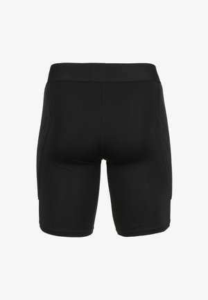 Shorts de sport noirs avec une texture lisse, un design ajusté et des coutures contrastées. Présentent une large ceinture élastique et des panneaux latéraux.