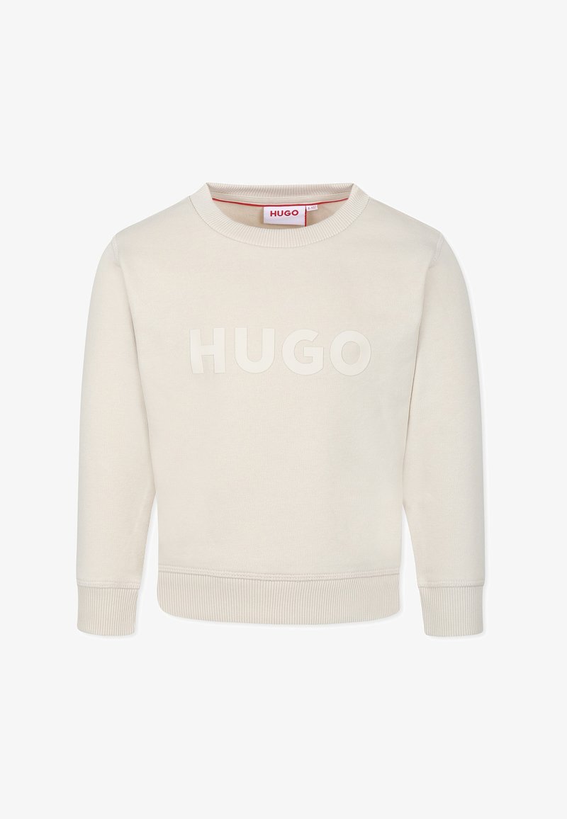 Sweatshirt beige à col rond avec un logo "HUGO" texturé sur le devant, des poignets et un ourlet côtelés, fabriqué à partir d'un matériau doux.