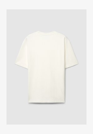 Maglietta in cotone color crema con vestibilità ampia, maniche corte e scollo rotondo. Tessuto liscio senza motivi o dettagli visibili.