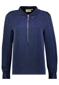 Blusa blu navy a maniche lunghe con colletto e zip frontale. Tessuto liscio con maniche aderenti e un design minimalista.