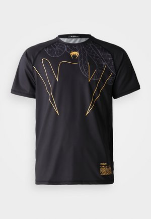 Black short-sleeve athletic shirt with gold snake fang design and subtle snake scale pattern across the upper chest and right shoulder.