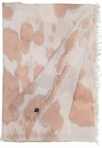 Bufanda ligera de tela suave, con una base cremosa y grandes manchas abstractas en color beige y bordes deshilachados para darle textura. Etiqueta de la marca visible.
