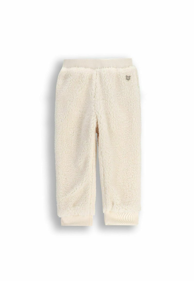 Joggery z dzianiny w kolorze kremowym, wykonane z miękkiego, teksturowanego materiału, z prążkowanym paskiem w talii i mankietami oraz małym akcentem z logo.