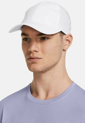 White cap with perforated sides and embroidered logo. Smooth fabric with a curved brim, worn with a lavender shirt.