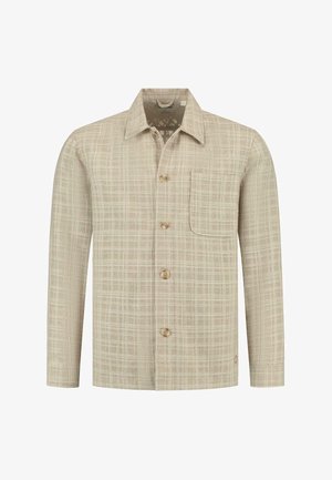 Kreminė languota marškinė su ilgomis rankovėmis, apykakle, krūtine kišenė ir penkiomis rudos spalvos mygtukais. Audinys turi švelnų, tekstūruotą išvaizdą.