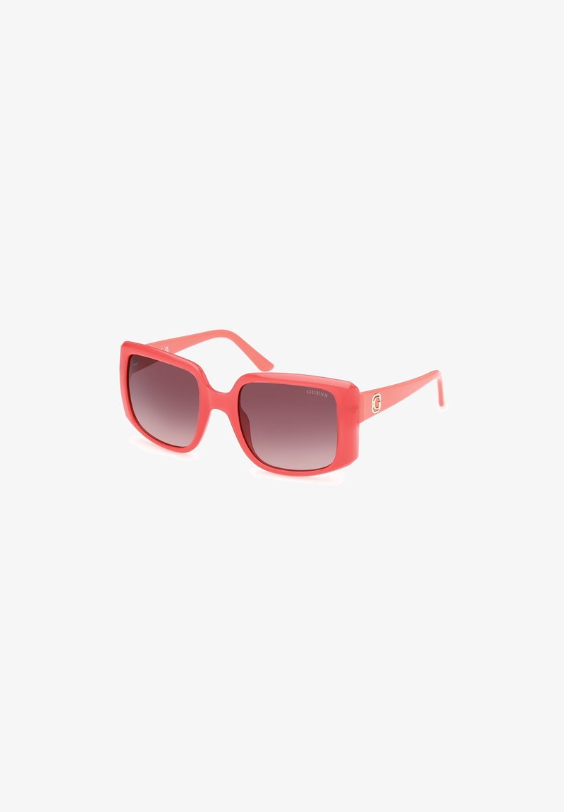 Red rectangular sunglasses with gradient dark lenses, made of matte plastic. Features a subtle logo on the arm. Solid design with wide frame.