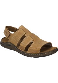 Tan leather sandal with open design, featuring three adjustable straps, stitched detailing, and a textured sole for grip.