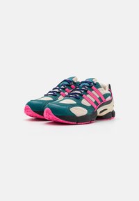 Sneakers with a teal, pink, and cream color scheme. Features mesh and leather materials, rubber soles, and multicolored laces.