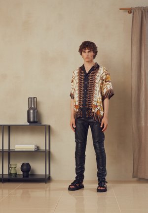 TROUSERS - Pantaloni di pelle - black