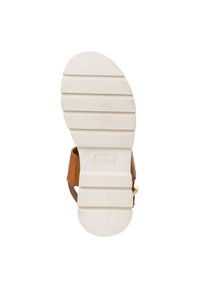 Brown sandal with a textured white rubber sole. Features a smooth upper with a gold buckle detail. Clearly marked brand logo on the sole.