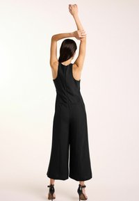 Next RACER WIDE REGULAR FIT - Kezeslábas - black