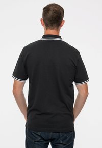 Paradiso Clothing THE BEATLES DRUM UNISEX - Polo shirt - black