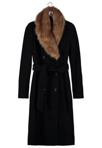 Sort uldfrakke med en brun faux fur krave, dobbeltknaplukning med knapper og et matchende stofbælte. Lange ærmer og mellemlang design.