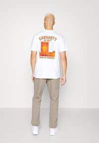 WRSTBHVR Träningsbyxor - beige