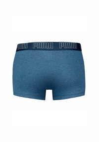 Boxer shorts in cotone blu con elastico in vita di colore navy e logo PUMA. Texture liscia, taglio a vita media, con orli cuciti.