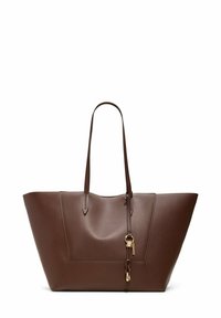 Brown leather tote bag with long handles and a decorative knotted strap with gold hardware on a white background.
