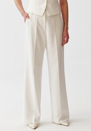 Discover white Trousers online  It's the women who wear the