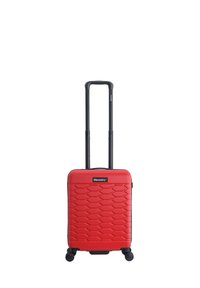 Red hardshell carry-on suitcase with a textured honeycomb pattern, retractable black handle, and four wheels for mobility.