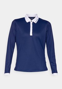 Námořnická polo košile s dlouhým rukávem vyrobená z hladké látky, s bílým límcem a zapínáním. Obsahuje jemné logo značky na límci.