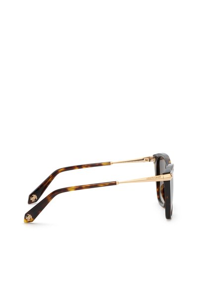 Lunettes de soleil en écaille et ton or avec montures épaisses et branches griffées, vues de profil sur fond blanc.