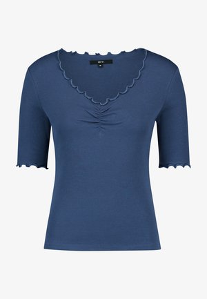 Haut court à manches courtes côtelé bleu avec bords en feston aux manches et à l'encolure, présentant un léger froncé au centre devant.