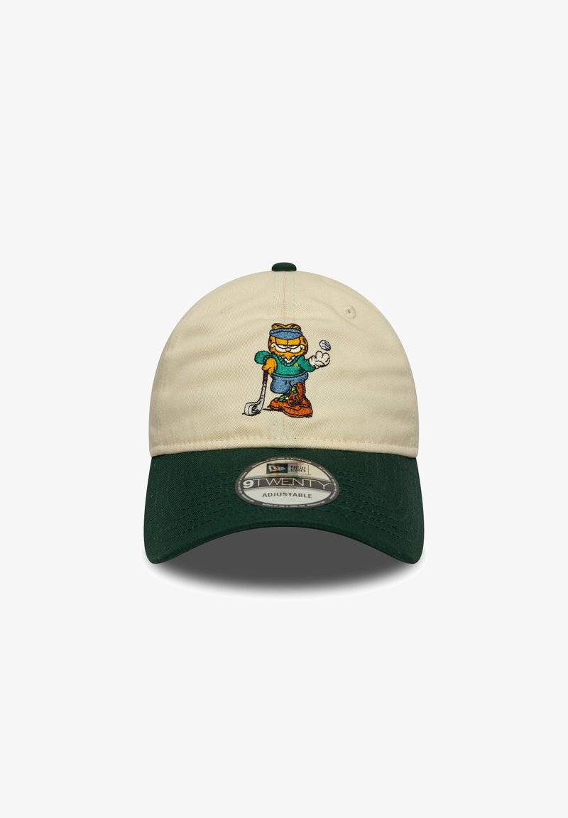Adjustable cap with a cream cotton body and green visor. Features an embroidered cartoon character in sports attire, holding a golf ball.