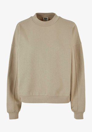 Beige sweatshirt med høj krave, ribbede manchetter og afslappet pasform. Materialet ser blødt ud med en tekstureret overflade.
