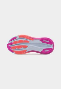 Sole of a running shoe with pink, purple, and orange rubber grips and a light gray base, showing tread pattern for traction and flexibility.