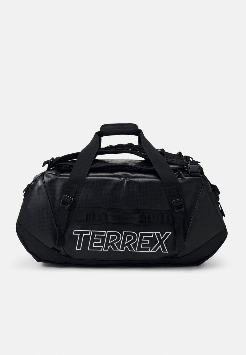 Sac de sport noir en matériau résistant, arborant un logo "TERREX" blanc bien visible, diverses sangles et un design élégant et arrondi.