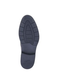 Black rubber shoe sole featuring textured grip patterns, slightly raised heel, and embossed logo "rieker." Smooth surfaces with defined tread lines.