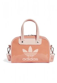 Pink glossy synthetic handbag with a zip closure, double top handles, detachable shoulder strap, and prominent white Adidas logo on the front.